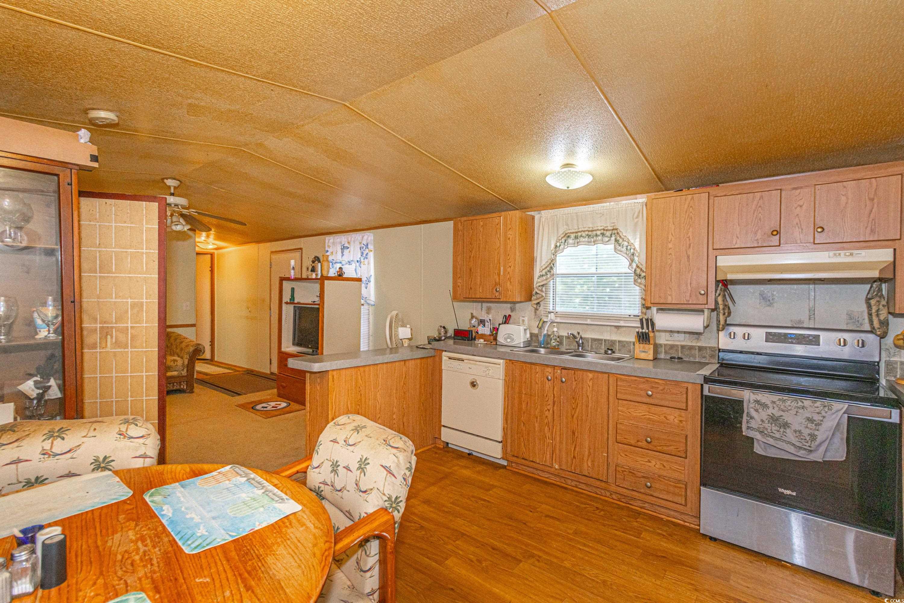 98 Offshore Drive Murrells Inlet, SC 29576 - Photo 8 of 27 Kitchen with electric range, dishwasher, under cab