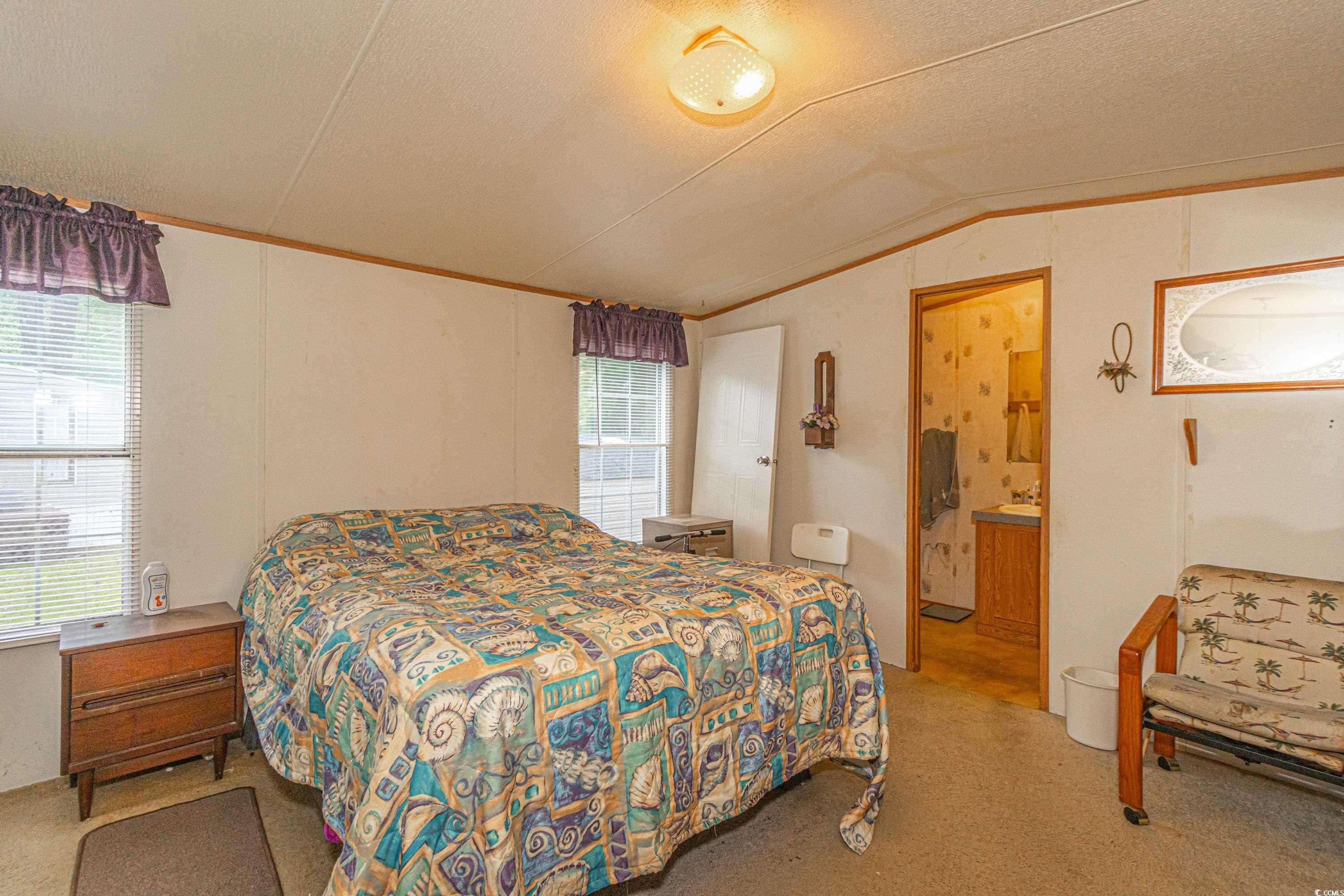 98 Offshore Drive Murrells Inlet, SC 29576 - Photo 10 of 27 Bedroom featuring vaulted ceiling, crown molding,