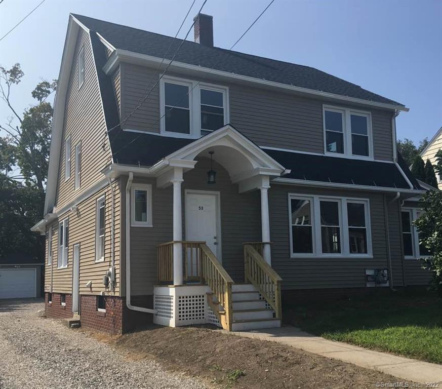 53 Lawlor Street Waterbury, CT 06708 - Photo 1 of 1 a front view of a house with a yard