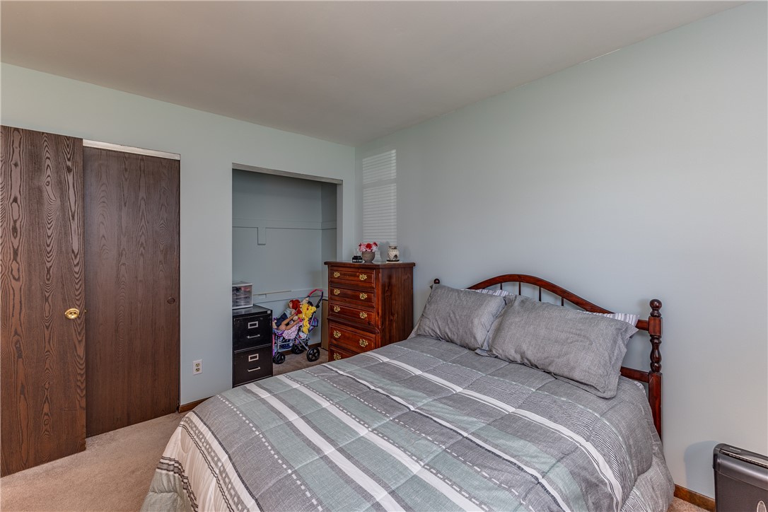 4210 Pleasanton Road Englewood, OH 45322 - Photo 26 of 34 This cozy bedroom provides a comfortable retreat with ample storage and soft carpeting.