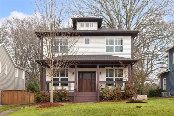 front view of a house with a yard