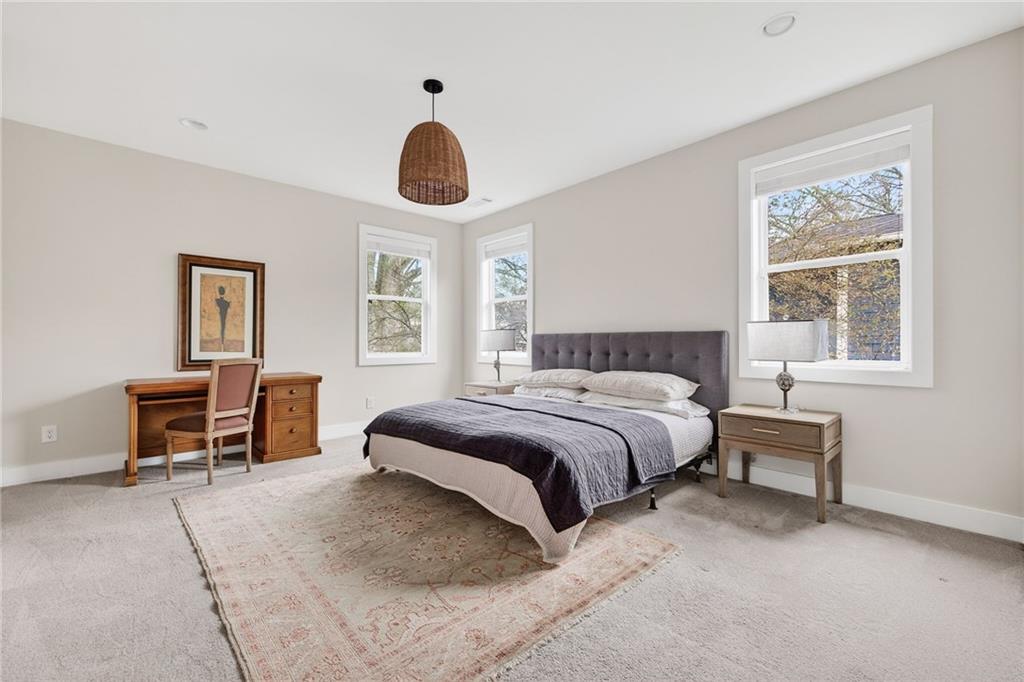 209 Ridgeland Avenue Decatur, GA 30030 - Photo 17 of 23 a bedroom with a bed and a desk