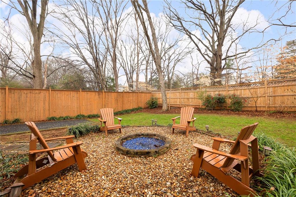 209 Ridgeland Avenue Decatur, GA 30030 - Photo 22 of 23 a view of a lake with couches and wooden fence