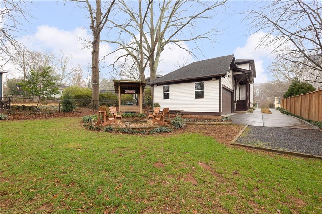 209 Ridgeland Avenue Decatur, GA 30030 - Photo 23 of 23 a backyard of a house with table and chairs