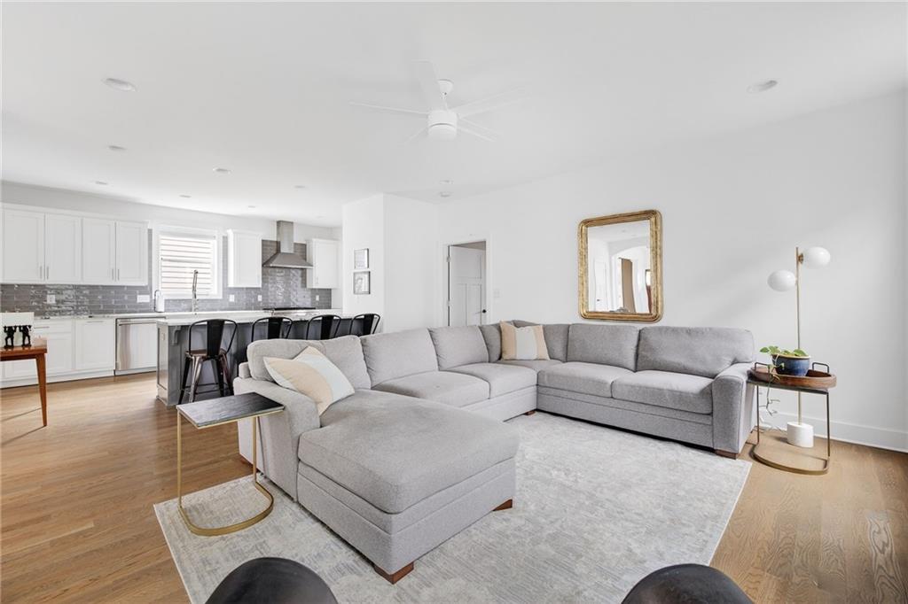 209 Ridgeland Avenue Decatur, GA 30030 - Photo 10 of 23 a living room with furniture and a wooden floor