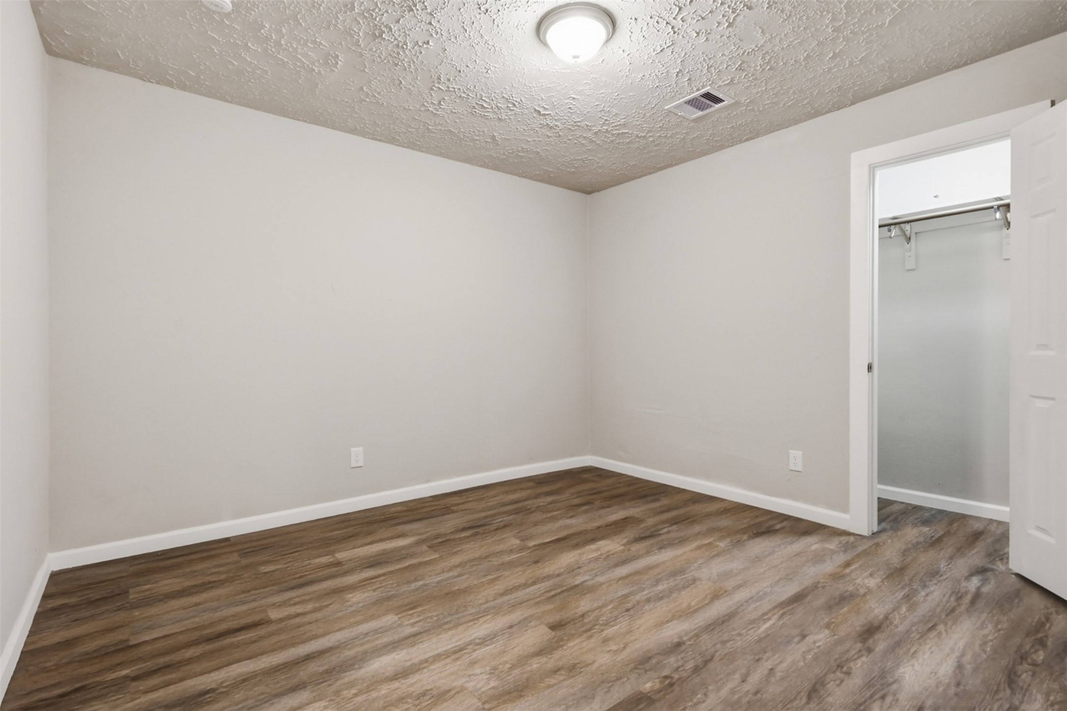 4767 Beechaven Street Houston, TX 77053 - Photo 21 of 26 a view of an empty room with wooden floor