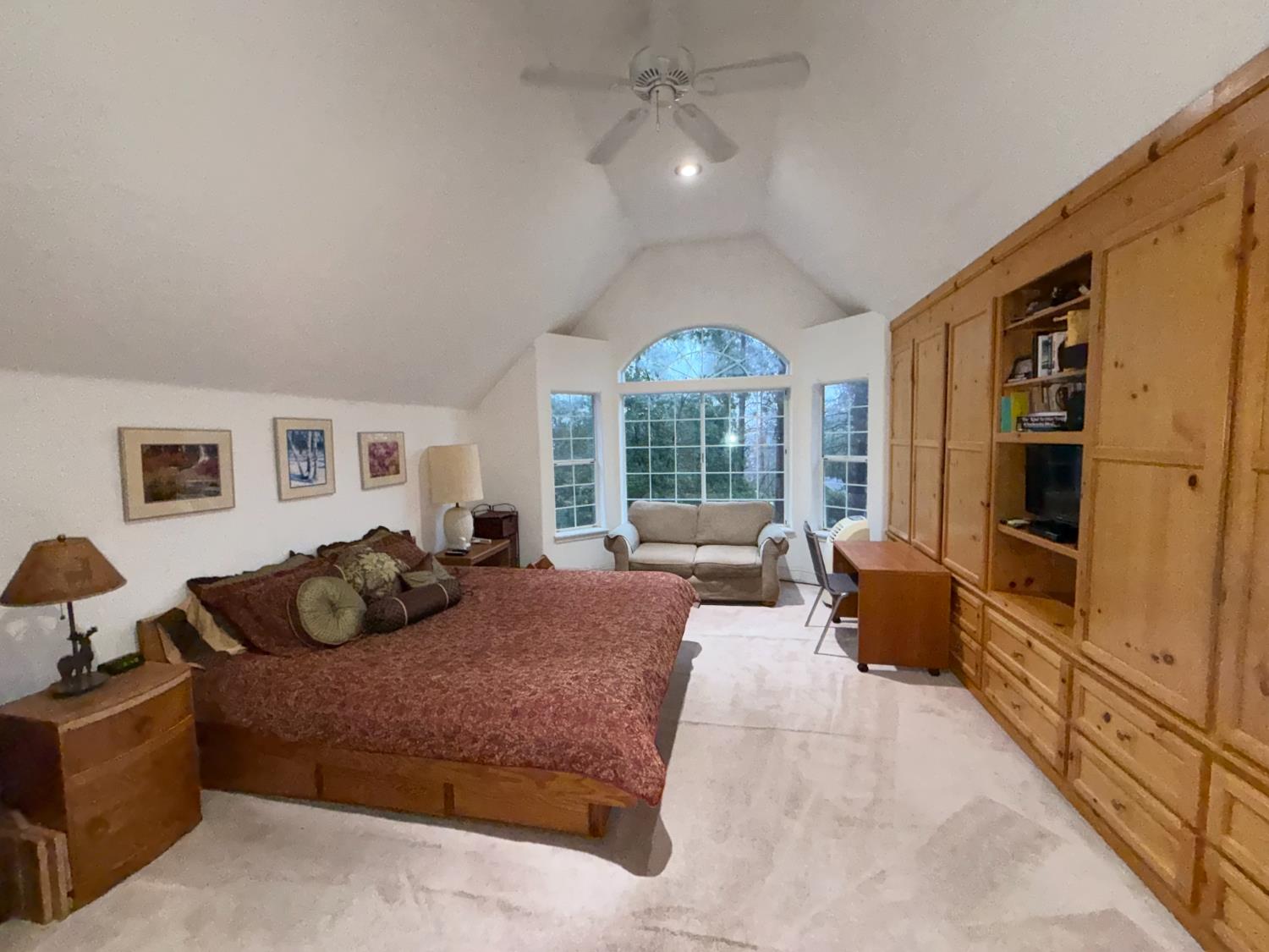 645 Rigby Lane Applegate, CA 95703 - Photo 28 of 52 a bedroom with a bed and wooden floor