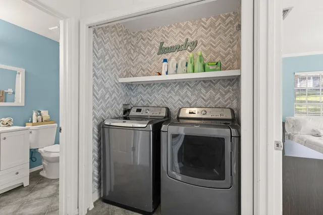 a utility room with dryer and washer