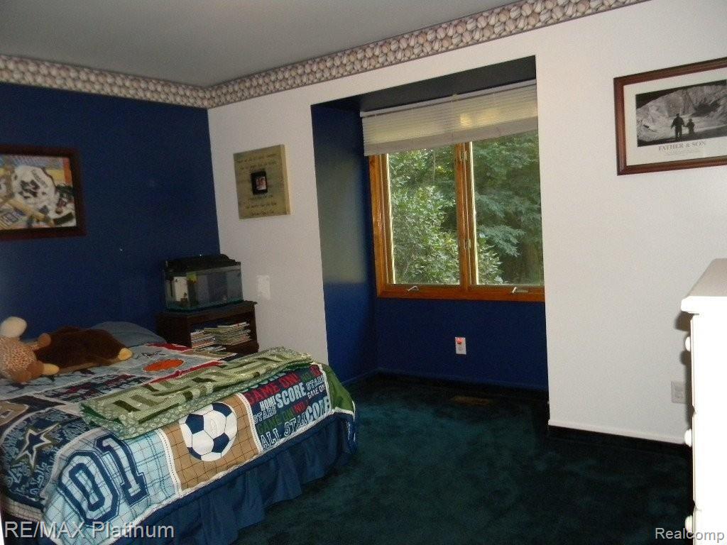 1240 Grebe Road Highland, MI 48357 - Photo 15 of 25 1 of 2 First Fl. Bedrooms