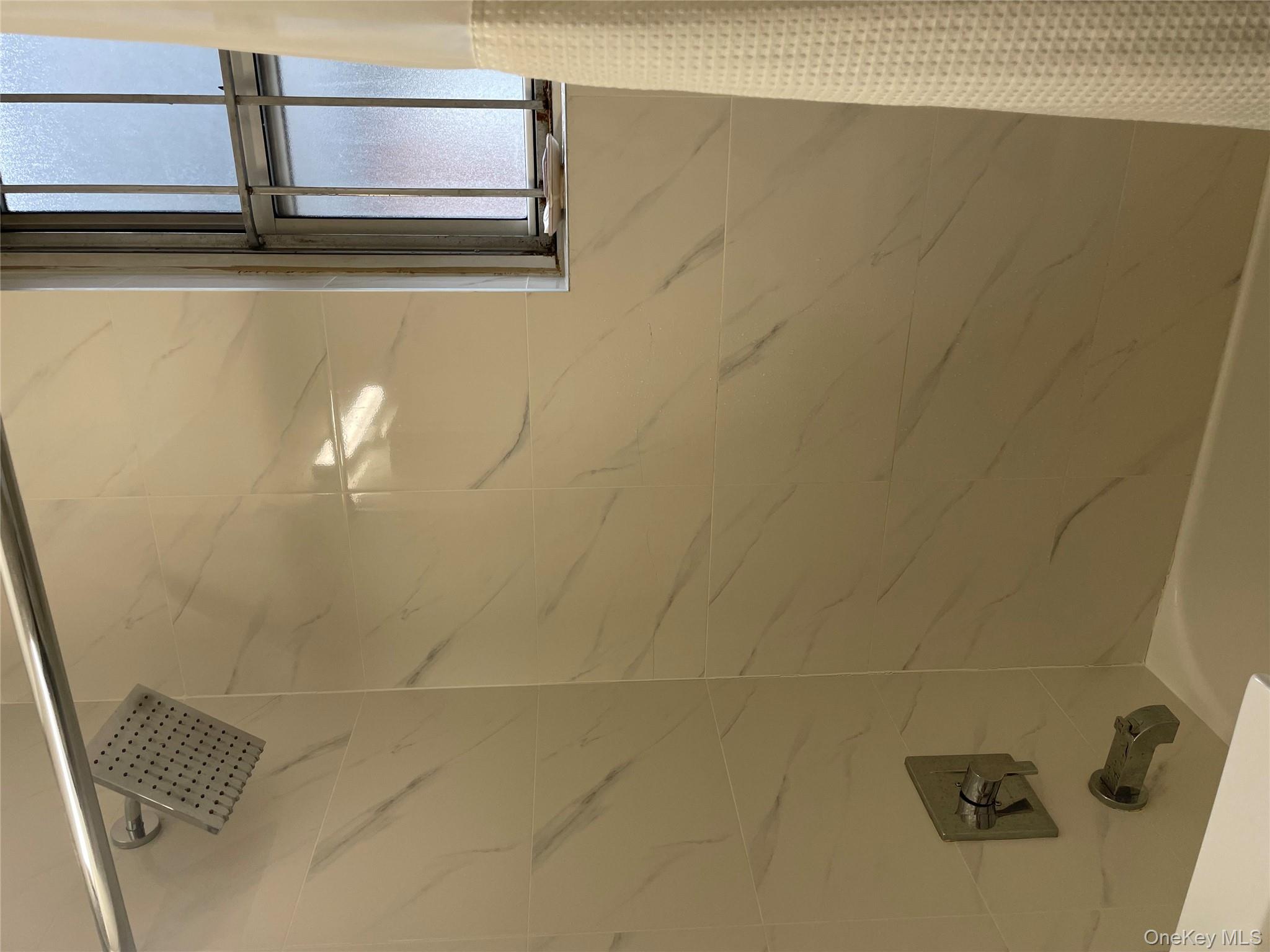 1430 Thieriot Avenue, Unit 6J Bronx, NY 10460 - Photo 9 of 15 Bathroom featuring new bathtub / shower combination