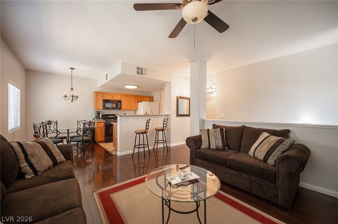 7701 West Robindale Road, Unit 274 Las Vegas, NV 89113 - Photo 7 of 38 This living space features rich hardwood flooring and an open-concept layout for comfortable living.