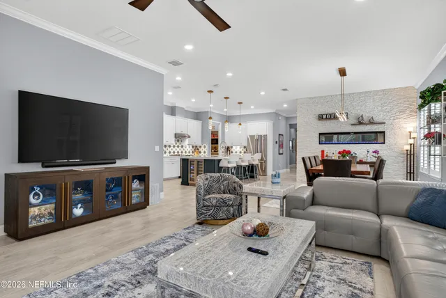 a kitchen with stainless steel appliances a cabinets and a window