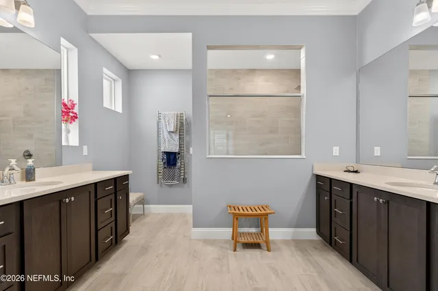 a view of swimming pool with lounge chairs in patio