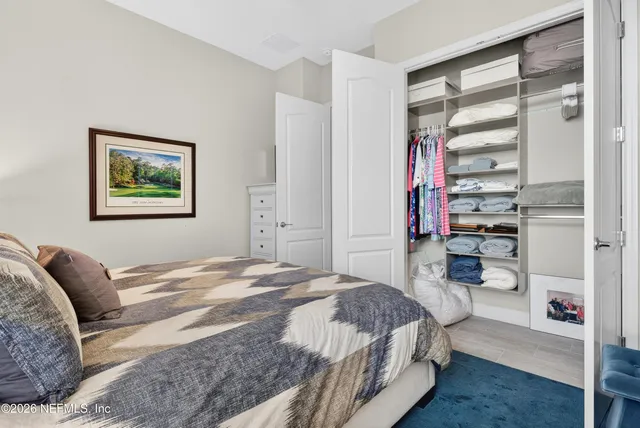 an aerial view of a house with a yard basket ball court and outdoor seating