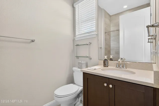 an aerial view of a house with swimming pool and garden