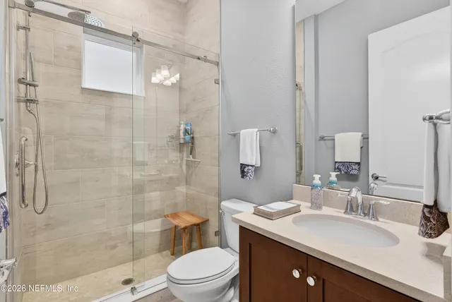 an aerial view of a house with a lake view