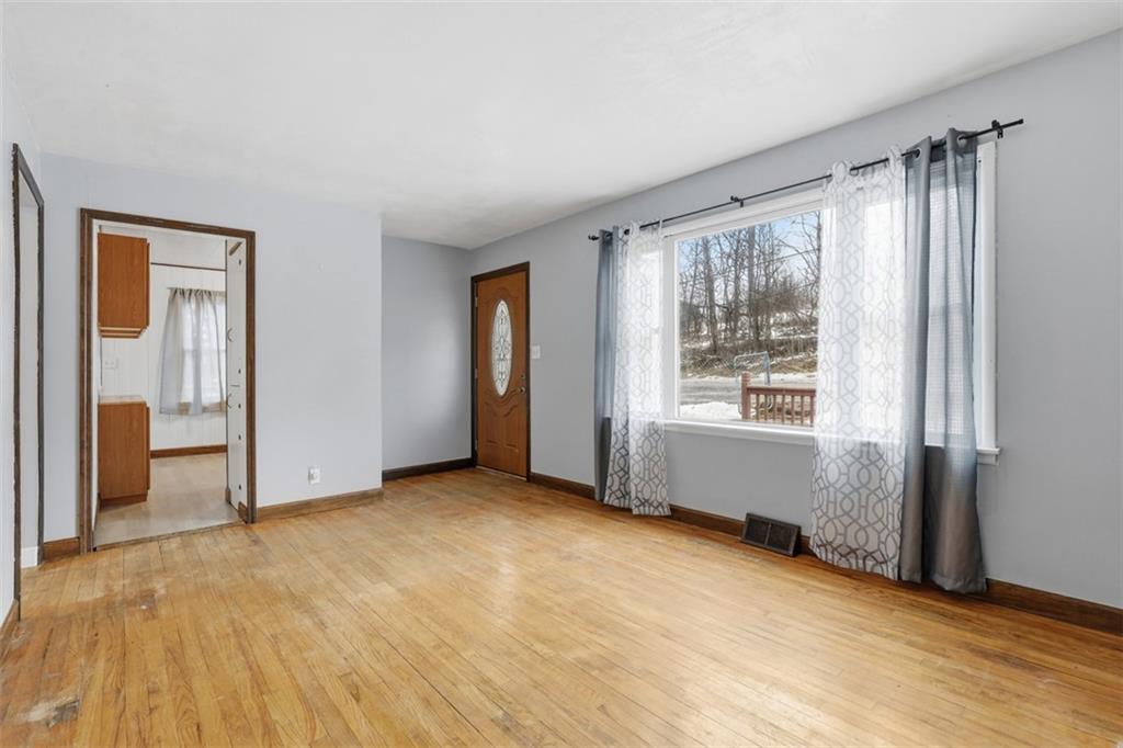 1395 Amity Ridge Road Washington, PA 15301 - Photo 9 of 44 LIVING ROOM WITH LARGE WINDOW ADDING EXTRA LIGHT