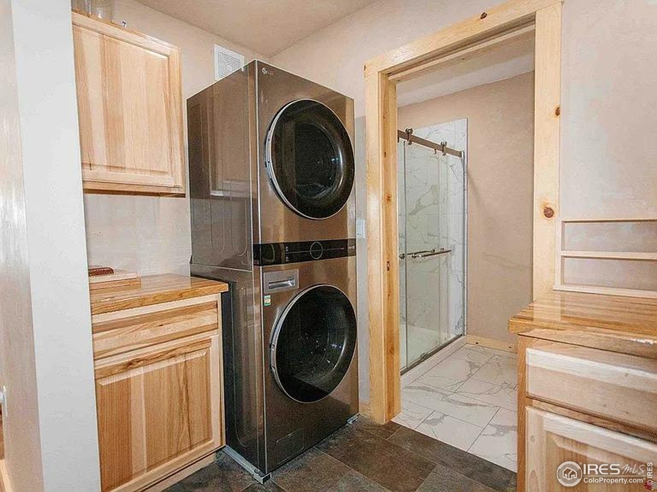 2209 Hatton Place Montrose, CO 81401 - Photo 14 of 41 a view of a hallway with washer and dryer