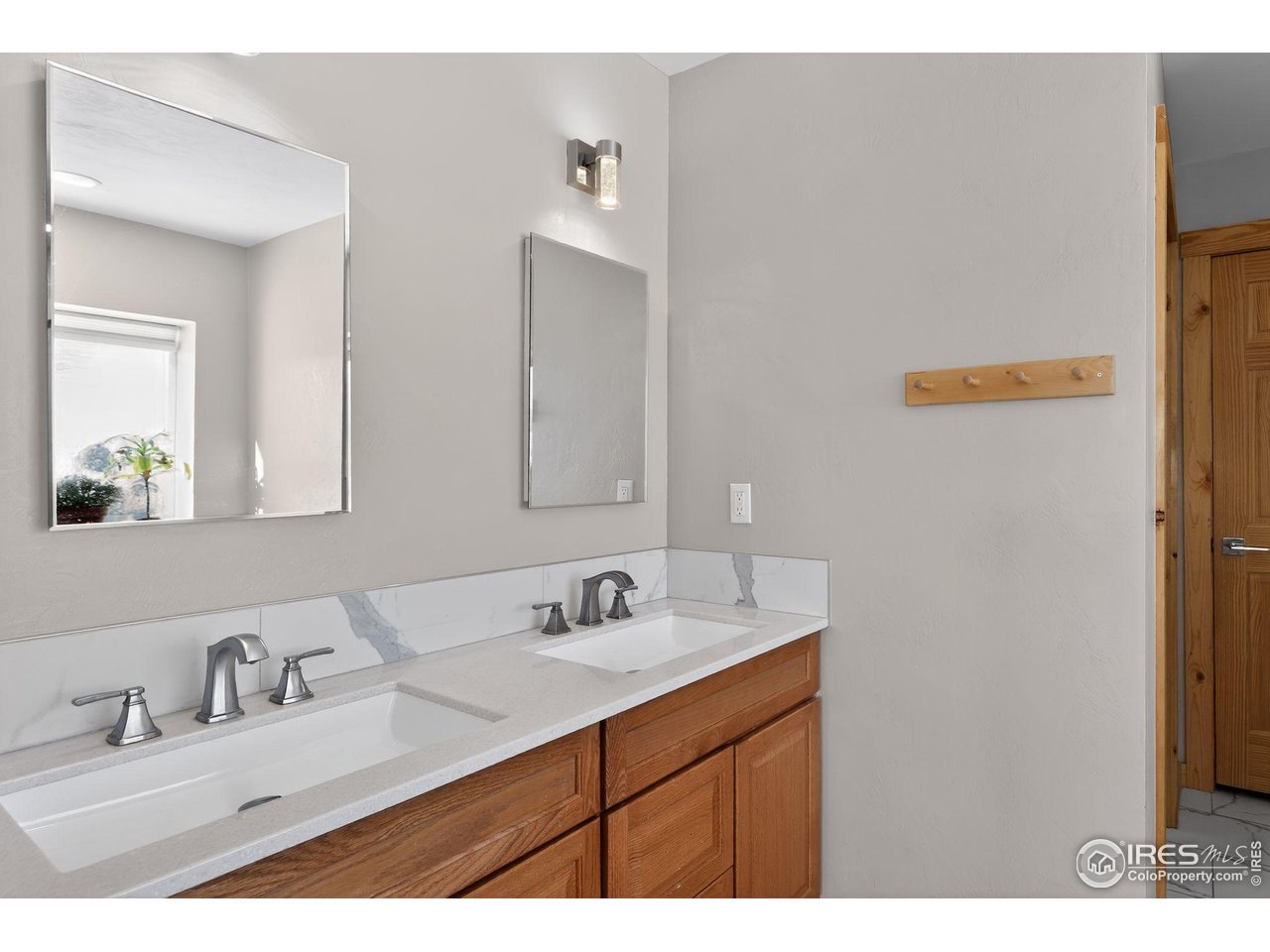 2209 Hatton Place Montrose, CO 81401 - Photo 19 of 41 a bathroom with a sink and a mirror