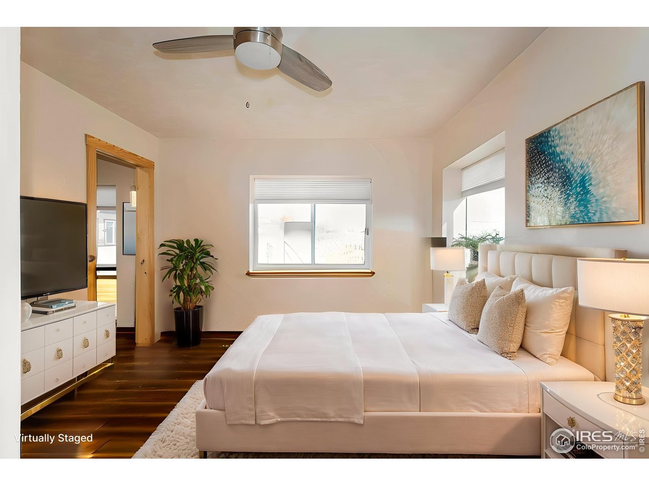 2209 Hatton Place Montrose, CO 81401 - Photo 20 of 41 a bedroom with a bed and a flat screen tv