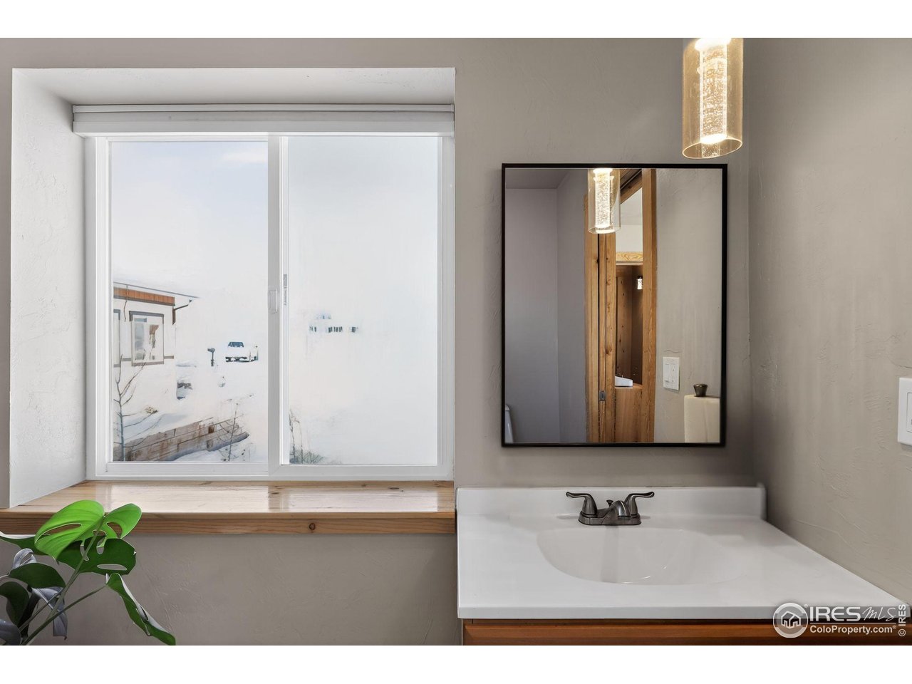 2209 Hatton Place Montrose, CO 81401 - Photo 21 of 41 a bathroom with a sink and a mirror