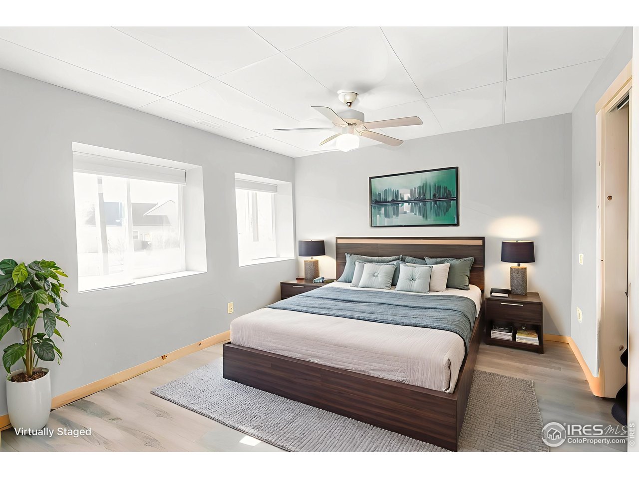 2209 Hatton Place Montrose, CO 81401 - Photo 33 of 41 a bedroom with a large bed chandelier and a window