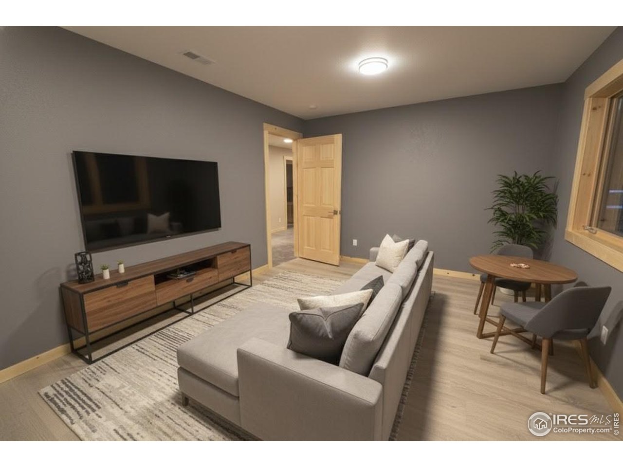 2209 Hatton Place Montrose, CO 81401 - Photo 34 of 41 a living room with furniture and a flat screen tv