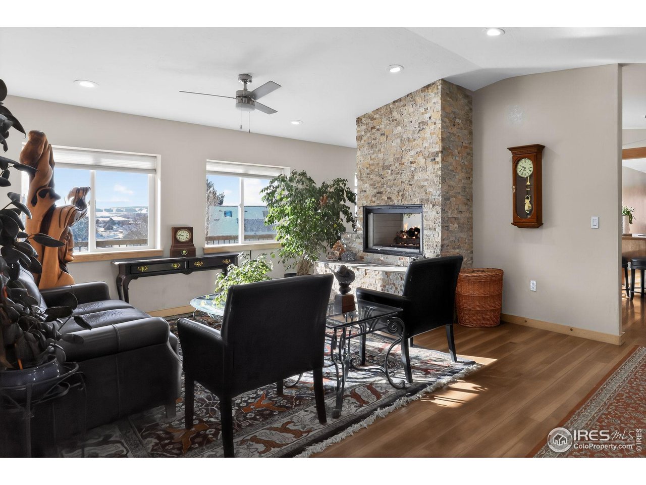 2209 Hatton Place Montrose, CO 81401 - Photo 5 of 41 a living room with furniture a fireplace and a flat screen tv