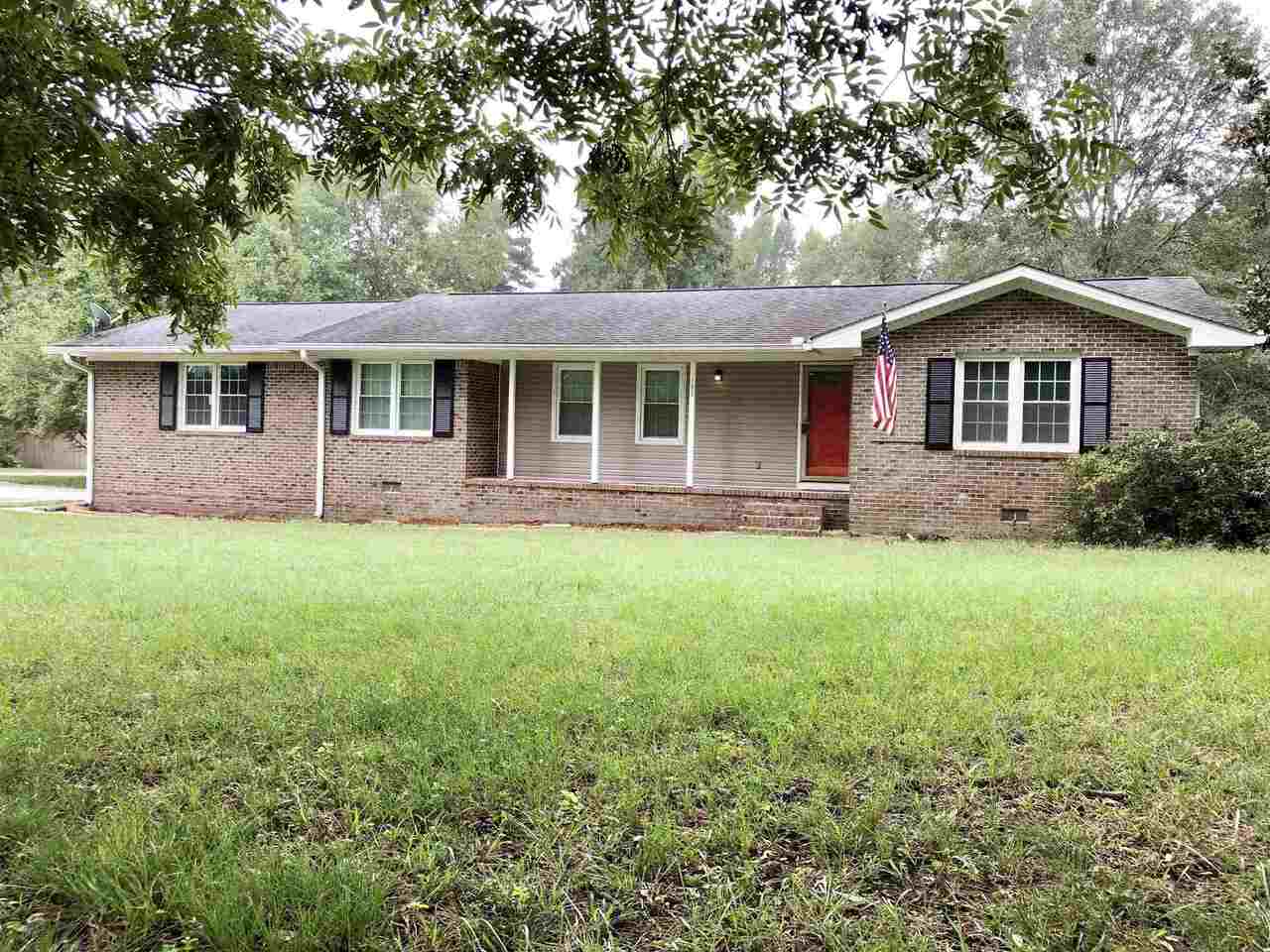 105 North Old Alabama Road Thomaston, GA 30286 - Photo 1 of 1 a front view of house with yard and green space