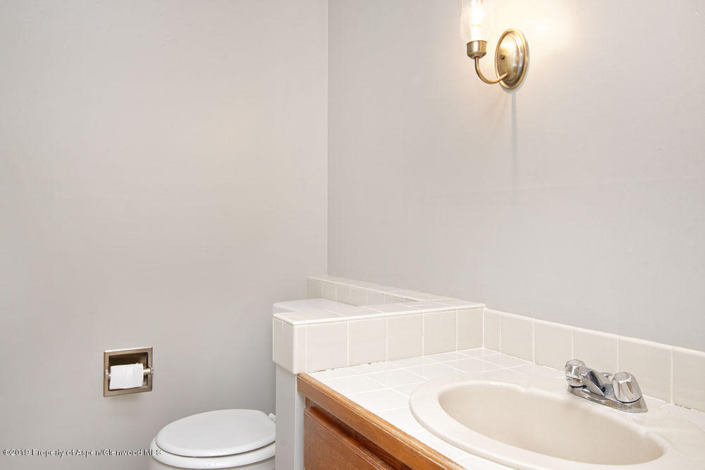 113 Crossland Drive Basalt, CO 81621 - Photo 11 of 23 a bathroom with a sink a toilet and a mirror