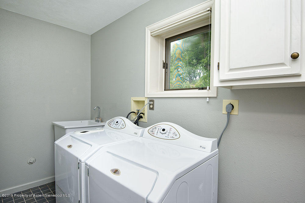 113 Crossland Drive Basalt, CO 81621 - Photo 15 of 23 a utility room with dryer and washer
