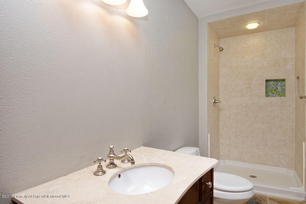 113 Crossland Drive Basalt, CO 81621 - Photo 16 of 23 a bathroom with a sink toilet and shower