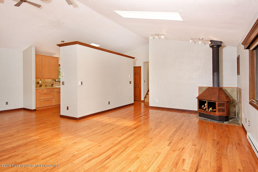 113 Crossland Drive Basalt, CO 81621 - Photo 2 of 23 a view of a hallway with wooden floor and a bathroom