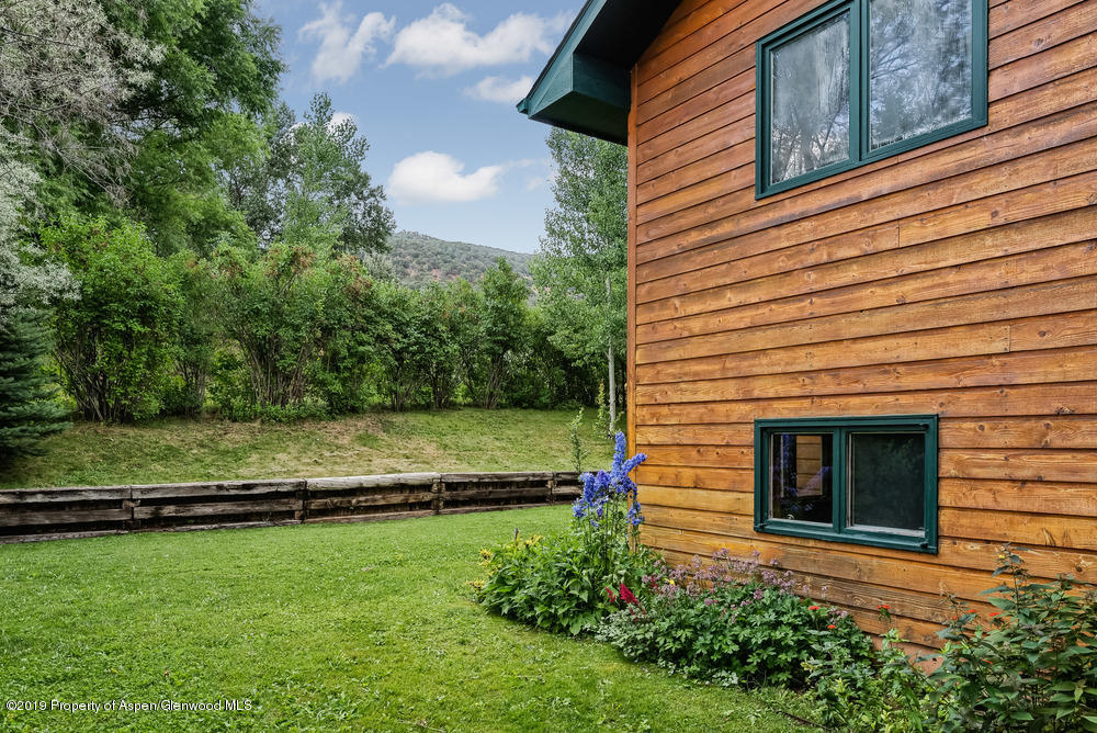 113 Crossland Drive Basalt, CO 81621 - Photo 21 of 23 a view of a backyard with wooden fence