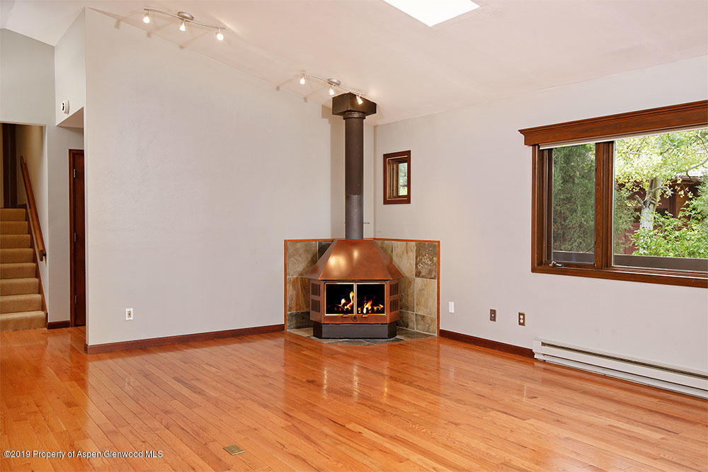 113 Crossland Drive Basalt, CO 81621 - Photo 5 of 23 a living room with hard wood floors and a window