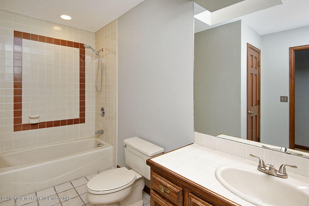 113 Crossland Drive Basalt, CO 81621 - Photo 8 of 23 a bathroom with a sink a toilet and shower