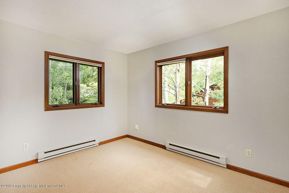 113 Crossland Drive Basalt, CO 81621 - Photo 9 of 23 a view of an empty room with a window
