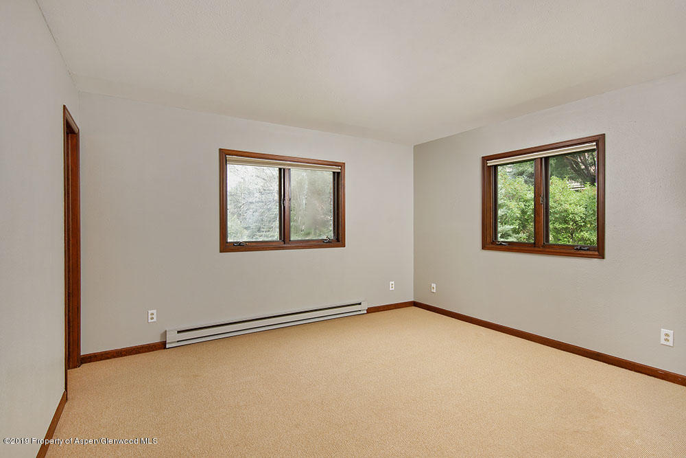 113 Crossland Drive Basalt, CO 81621 - Photo 10 of 23 a view of an empty room with a window