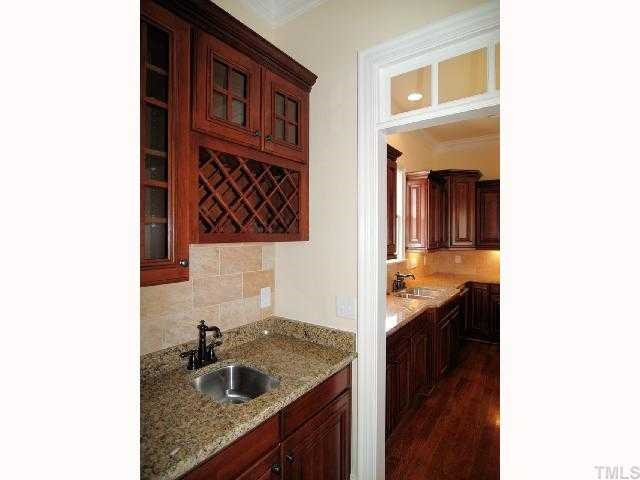 3109 Raymond Street Raleigh, NC 27607 - Photo 7 of 12 Wet bar in between kitchen and dining room. Perfect for entertaining! Other
