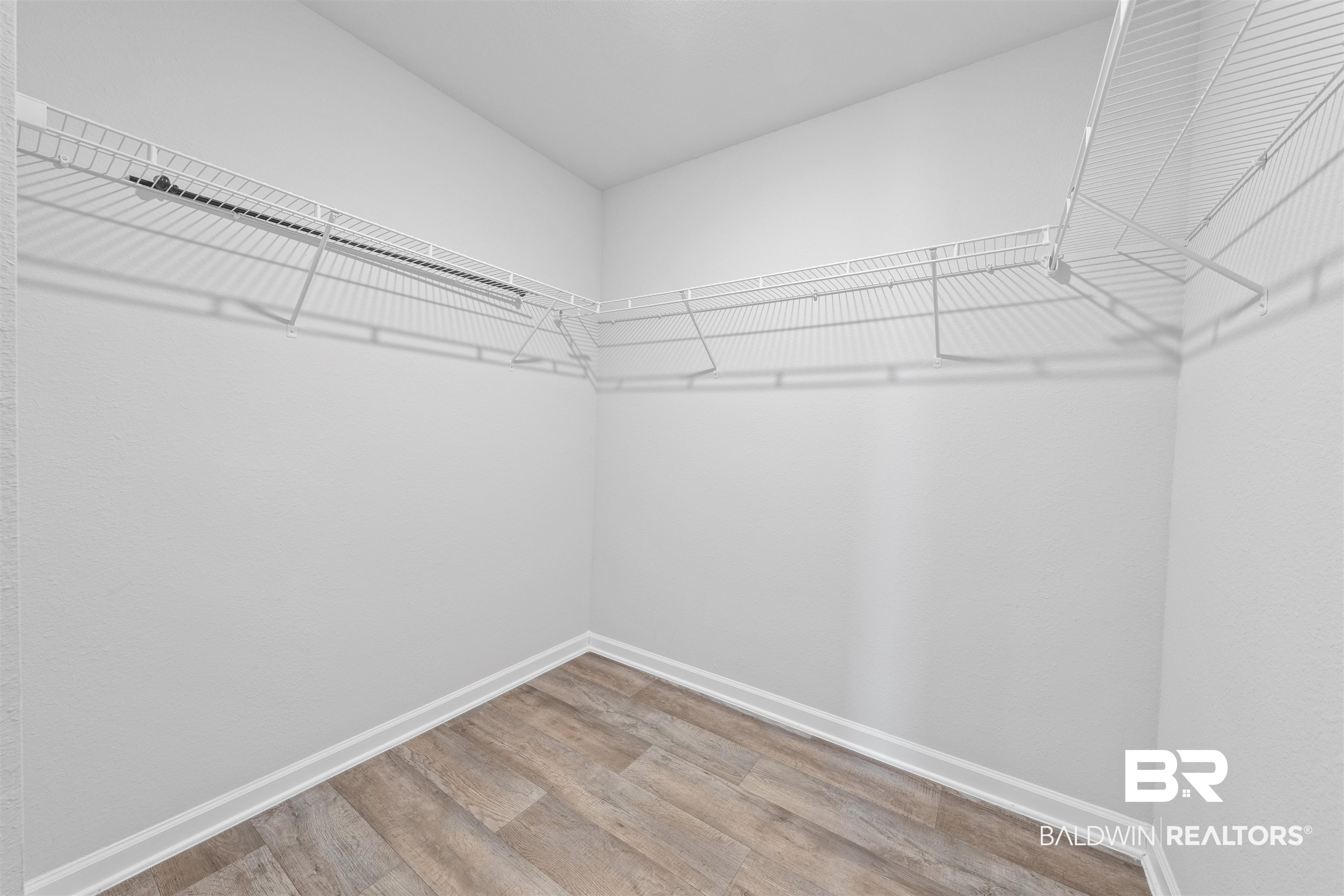 7457 Brompton Drive Foley, AL 36535 - Photo 15 of 24 Walk in closet featuring light wood-type flooring