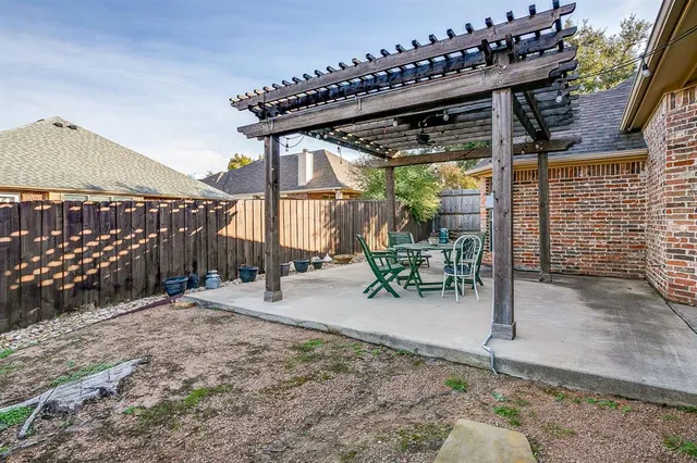 a view of a chairs and table in the patio