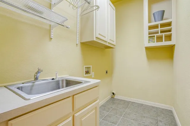 a bathroom with a sink and a window