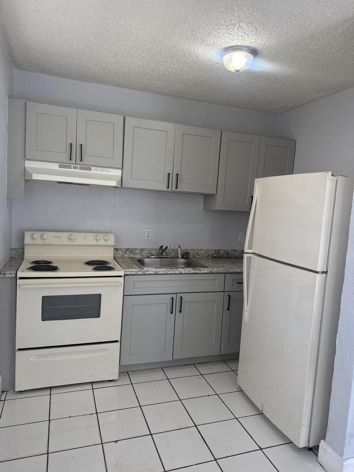 720 Southwest 7th Street, Unit 4 Dania Beach, FL 33004 - Photo 3 of 28 DJI_20260212_133245_914