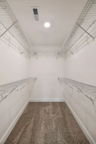 a view of a room with racks on the wall