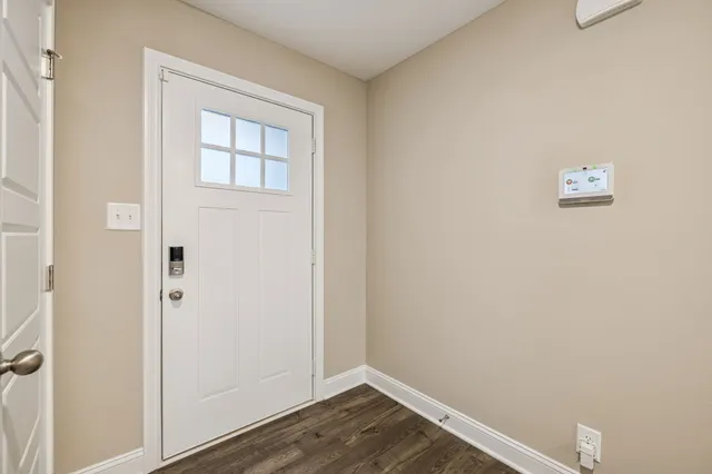 a view of a small space with wooden floor