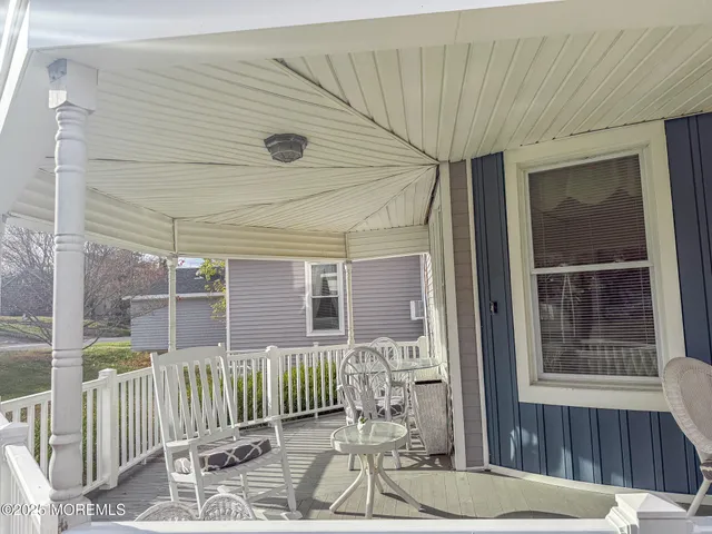 a view of a house with wooden deck