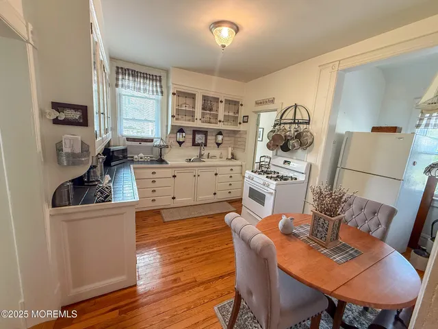 a view of a dining room with furniture and window