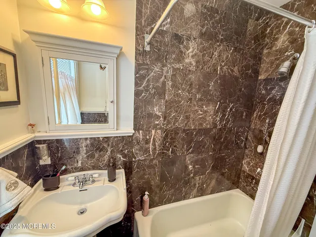 a bathroom with a sink and a bathtub