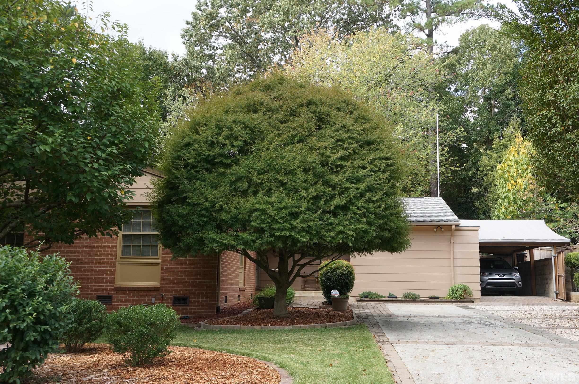4821 Latimer Road Raleigh, NC 27609 - Photo 1 of 21 front view of a house with a yard