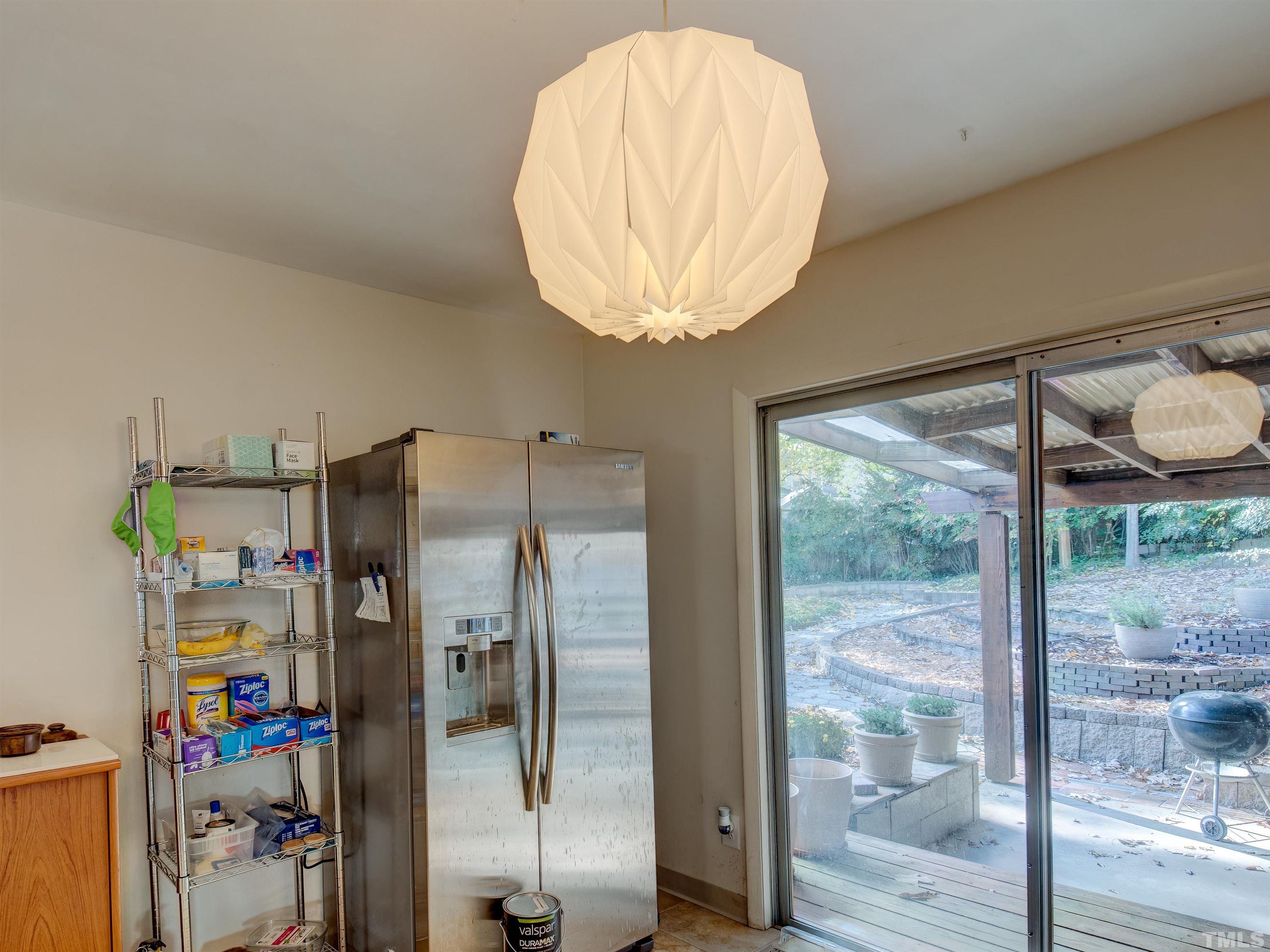 4821 Latimer Road Raleigh, NC 27609 - Photo 14 of 21 a room with a table and a chandelier